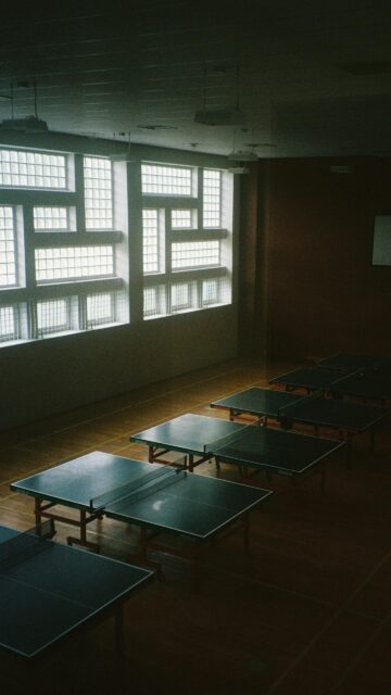 Minimalist Table Tennis Room with Dramatic Sunlight Mobile Wallpaper