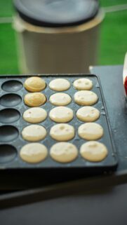 Freshly Baked Poffertjes on a Griddle Culinary Macro Mobile Wallpaper