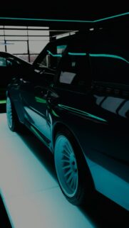Stunning Widebody Sports Car in Dark Neon Studio Wallpaper