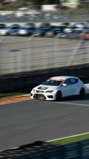 White Racing Cupra Car Speeding on Circuit Track Mobile Wallpaper