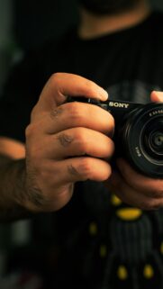 Professional Sony Camera Photographer Close-up Mobile Wallpaper