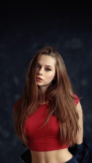 Beautiful Young Woman with Long Brown Hair in Red Top Mobile Wallpaper