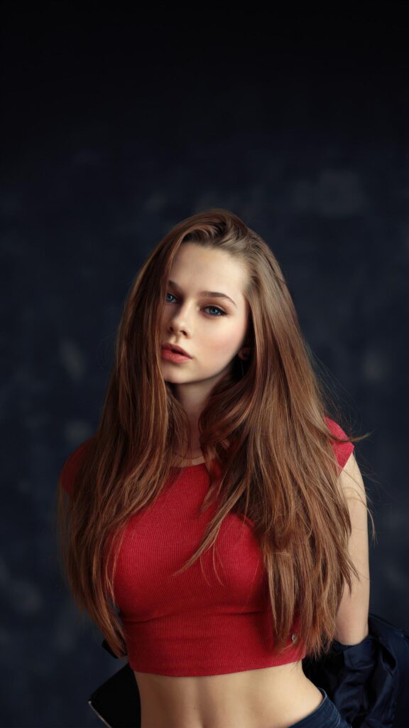 Beautiful Young Woman with Long Brown Hair in Red Top Mobile Wallpaper