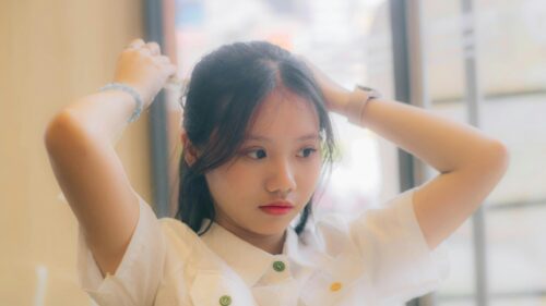 Young Asian Girl Fixing Her Hair Soft Portrait Desktop Wallpaper