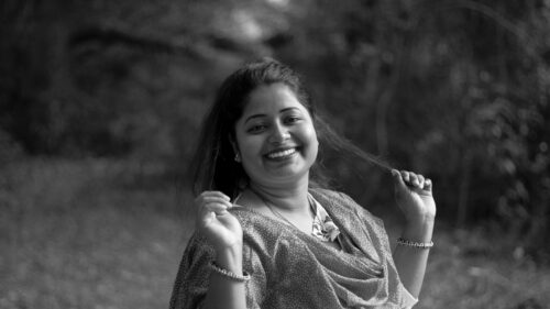Portrait of a Joyful Woman Smiling Outdoors Desktop Wallpaper