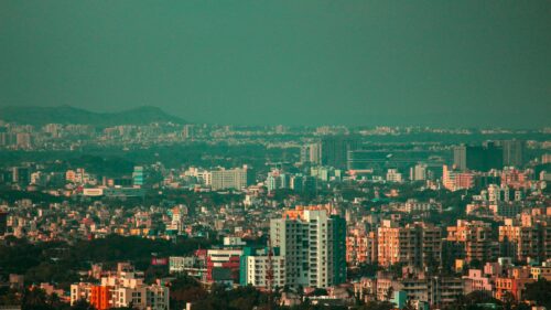 Aerial View of a Bustling Dense Urban Cityscape 4K Wallpaper