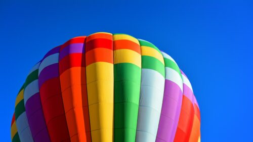 Vibrant Rainbow Hot Air Balloon Close-up 4K Wallpaper
