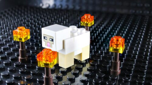 Cute Lego Minecraft Sheep Surrounded by Glowing Torches 4K Wallpaper