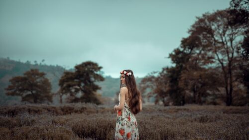 Dreamy Woman in Floral Dress Standing in Lavender Field Desktop Wallpaper