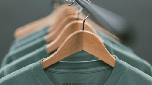 Minimalist Green T-Shirts on Wooden Hangers Desktop Wallpaper