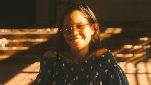 Beautiful Girl With Glasses Smiling In Golden Hour Sunlight 4K Wallpaper