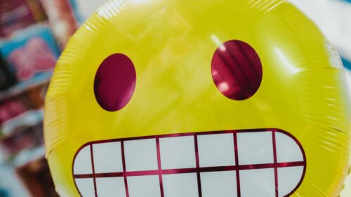 Grinning Yellow Emoji Balloon Face 4K Desktop Wallpaper