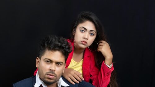 Stunning Fashionable Portrait of a Young Couple in Studio 4K Wallpaper