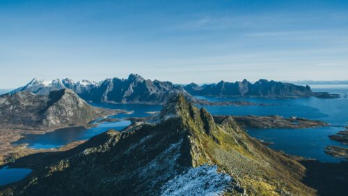Breathtaking Norway Mountain Peaks Over Blue Fjords 4K Wallpaper