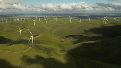 Stunning Green Hills and Renewable Energy Wind Farm 4K Wallpaper