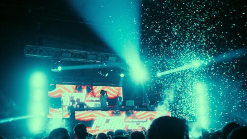 Electric Nightclub DJ Performance with Confetti 4K Wallpaper