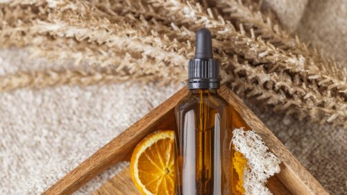 Amber Essential Oil Dropper Bottle with Dried Orange Desktop Wallpaper