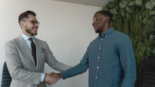Two Professionals Handshaking Business Meeting 4K Desktop Wallpaper