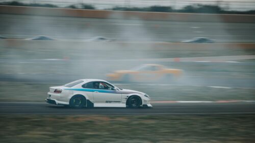 White Nissan Silvia S15 Drifting on Racetrack 4K Wallpaper
