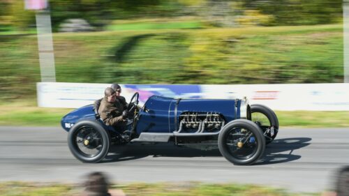 Vintage Blue Racing Car Speeding on Track Desktop Wallpaper