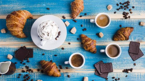 Fresh Coffee and Croissants on Rustic Blue Wood Desktop Wallpaper