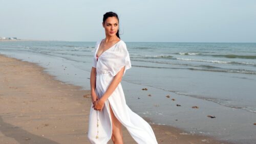 Stunning Gal Gadot in White Dress on Beach Desktop Wallpaper