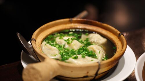 Steaming Hot Dumpling Soup in Traditional Clay Pot PC Wallpaper