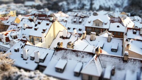 Tilt Shift View of Snowy European Rooftops Winter PC Wallpaper