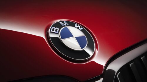 Elegant BMW Logo on Deep Red Metallic Car Hood 4K PC Wallpaper