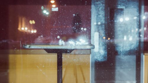 Melancholic Cafe Interior Through Dusty Window Desktop Wallpaper