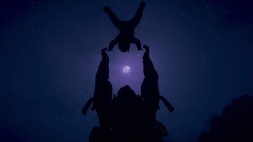 Silhouette of Astronaut Holding Baby Under Moonlit Night Sky 4K Wallpaper