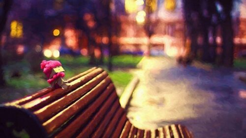 Cute Danbo Character Wearing a Pink Hat on a Park Bench Desktop Wallpaper