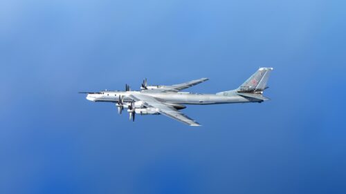Tupolev Tu-95 Bear Strategic Bomber Flying in Clear Blue Sky 4K Wallpaper