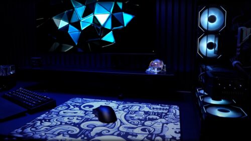 Minimalist Gaming Setup with Neon Blue Geometric Screen PC Wallpaper