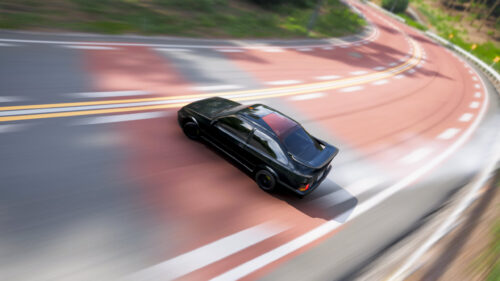 Black Ford Sierra RS Cosworth Drifting on Scenic Mountain Road PC Wallpaper