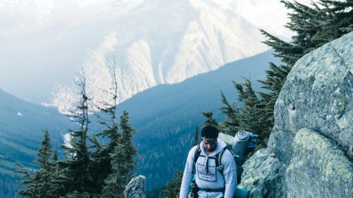 Hiker Exploring Majestic Mountain Ranges 4K PC Wallpaper