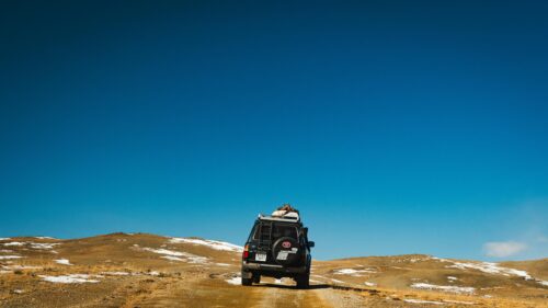 Toyota Land Cruiser Off-Road Adventure in Snowy Hills 4K Wallpaper