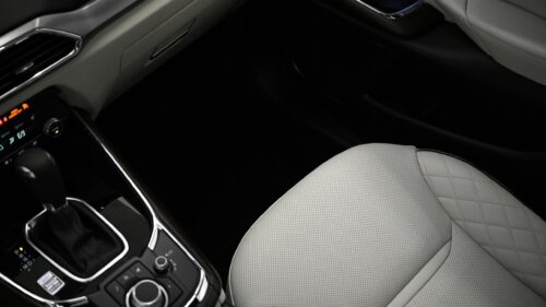 Luxurious Modern Car Interior with White Quilted Leather Seats 4K Wallpaper
