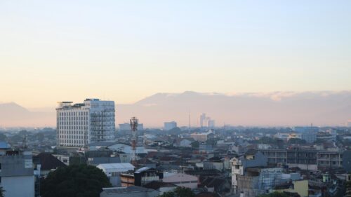 Breathtaking Misty Mountain Cityscape at Sunrise 4K Wallpaper