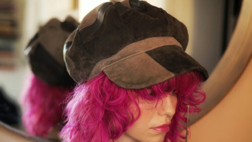 Stylish Girl with Vibrant Pink Hair and Suede Baker Boy Hat 4K Wallpaper