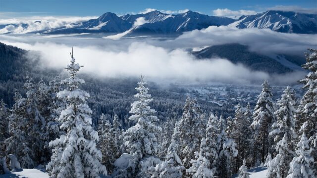 Breathtaking Snowy Mountain Village Landscape with Pine Forest 4K Wallpaper