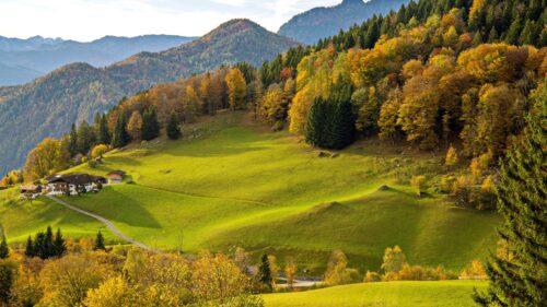 Stunning Alpine Autumn Landscape with Traditional Mountain Farmhouse Desktop Wallpaper