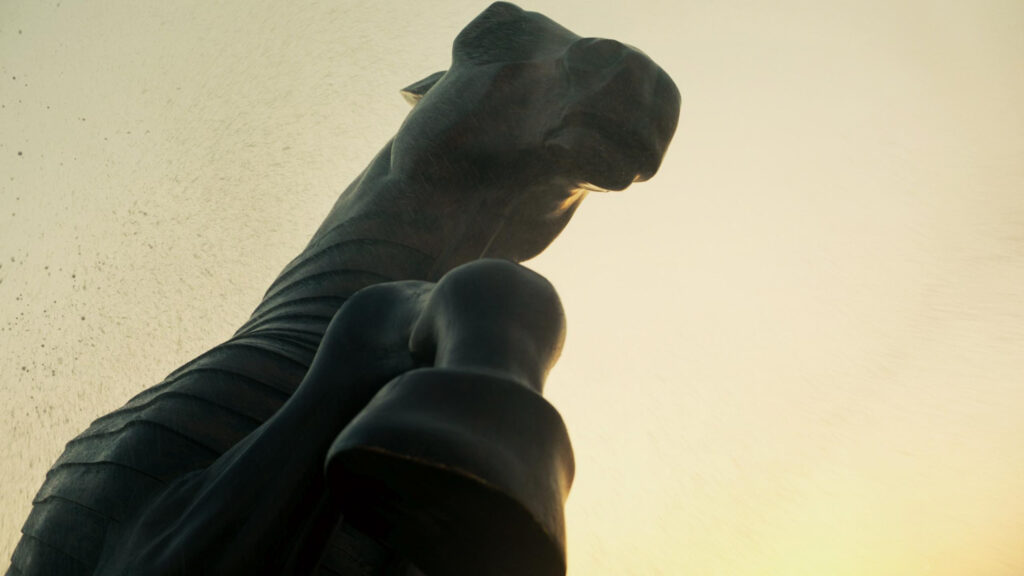 Majestic Bronze Horse Statue Silhouette Against Golden Light PC Wallpaper