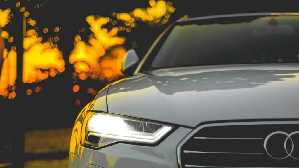 Elegant Audi Front View with Bokeh Night Lights PC Wallpaper