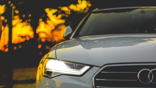 Elegant Audi Front View with Bokeh Night Lights PC Wallpaper