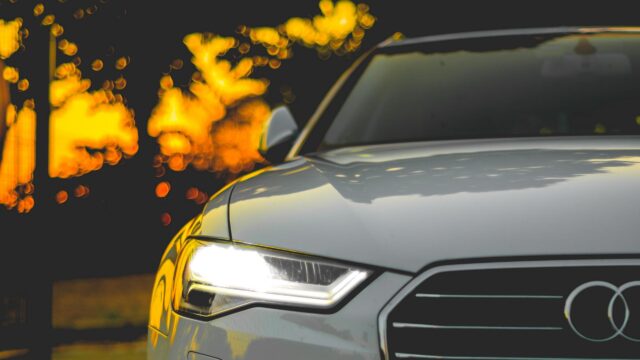Elegant Audi Front View with Bokeh Night Lights PC Wallpaper