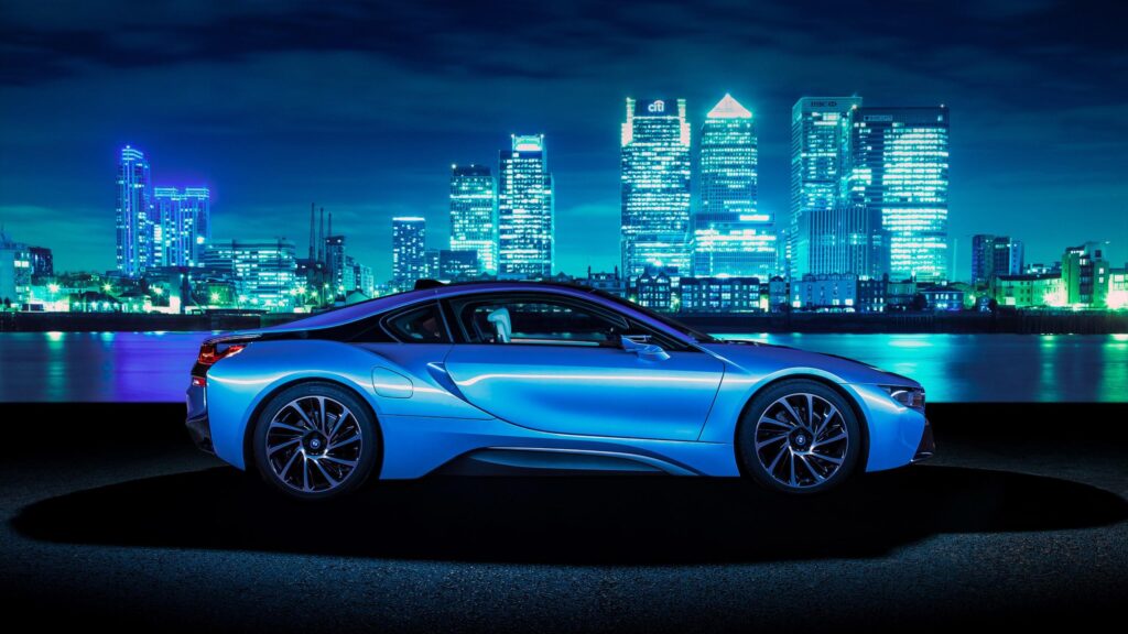 Stunning Blue BMW i8 Sports Car at Night City Skyline PC Wallpaper