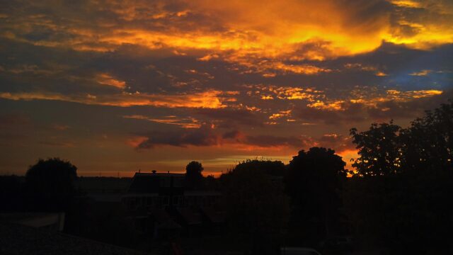 Dramatic Fiery Sunset Sky Over Suburban Silhouette PC Wallpaper
