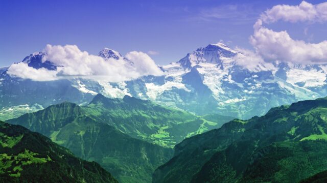 Stunning Swiss Alps Mountain Peaks with Lush Green Valleys 4K Wallpaper