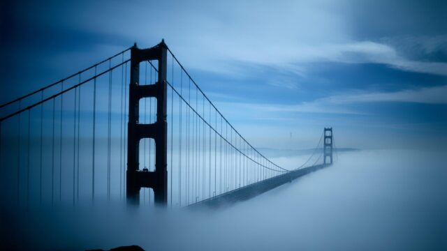 Stunning Golden Gate Bridge Surrounded by Dense Morning Fog 4K Wallpaper